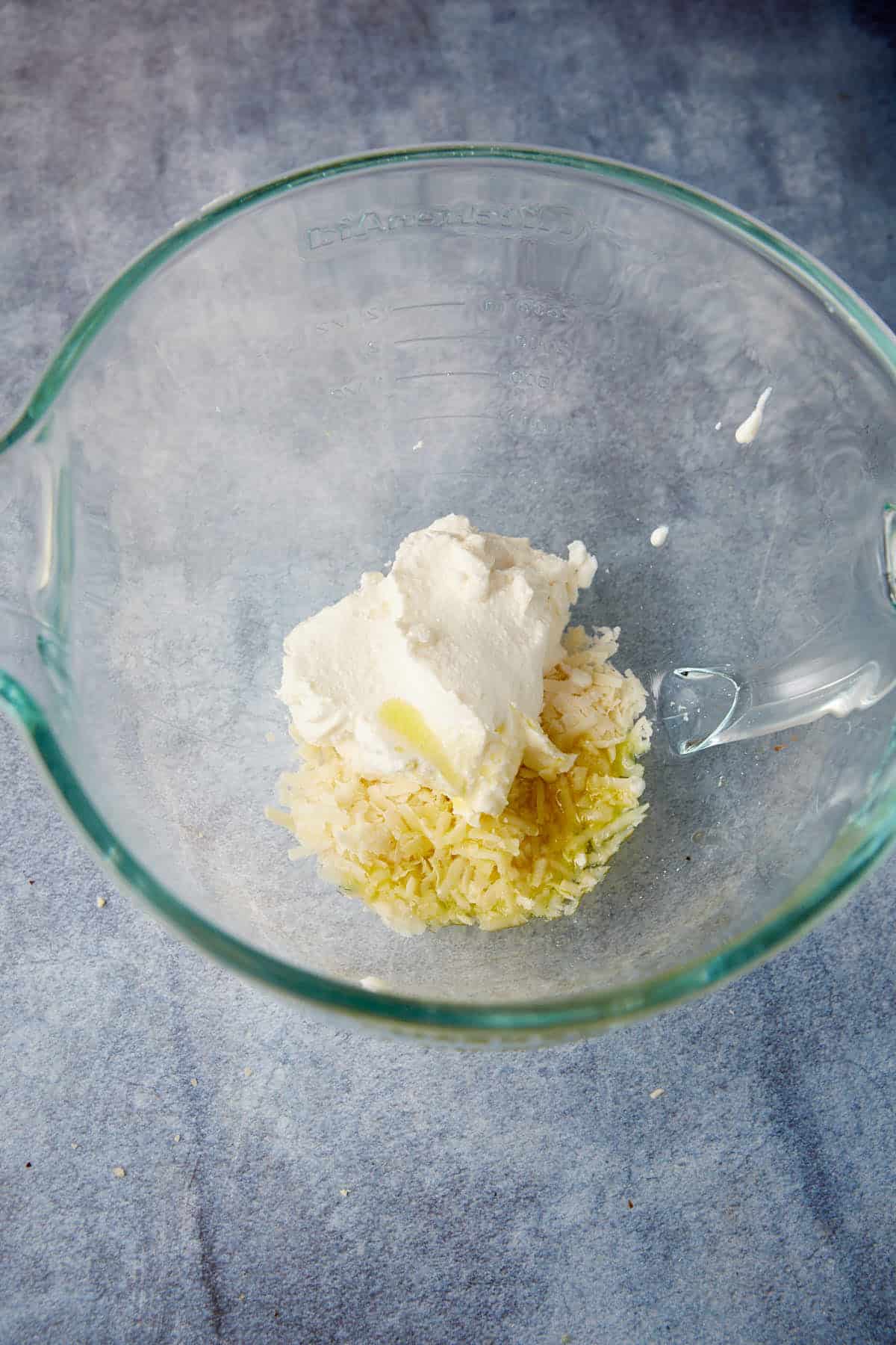 ricotta, garlic and olive oil in a mixing bowl.