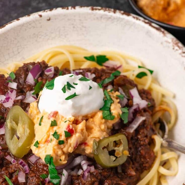 A bowl of Cincinnati chili with all the toppings