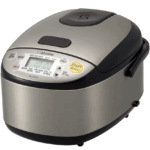 A stainless steel Zojirushi rice cooker with a digital display and various cooking buttons, perfect for making one pot chicken and rice, features a black lid and is shown on a white background.