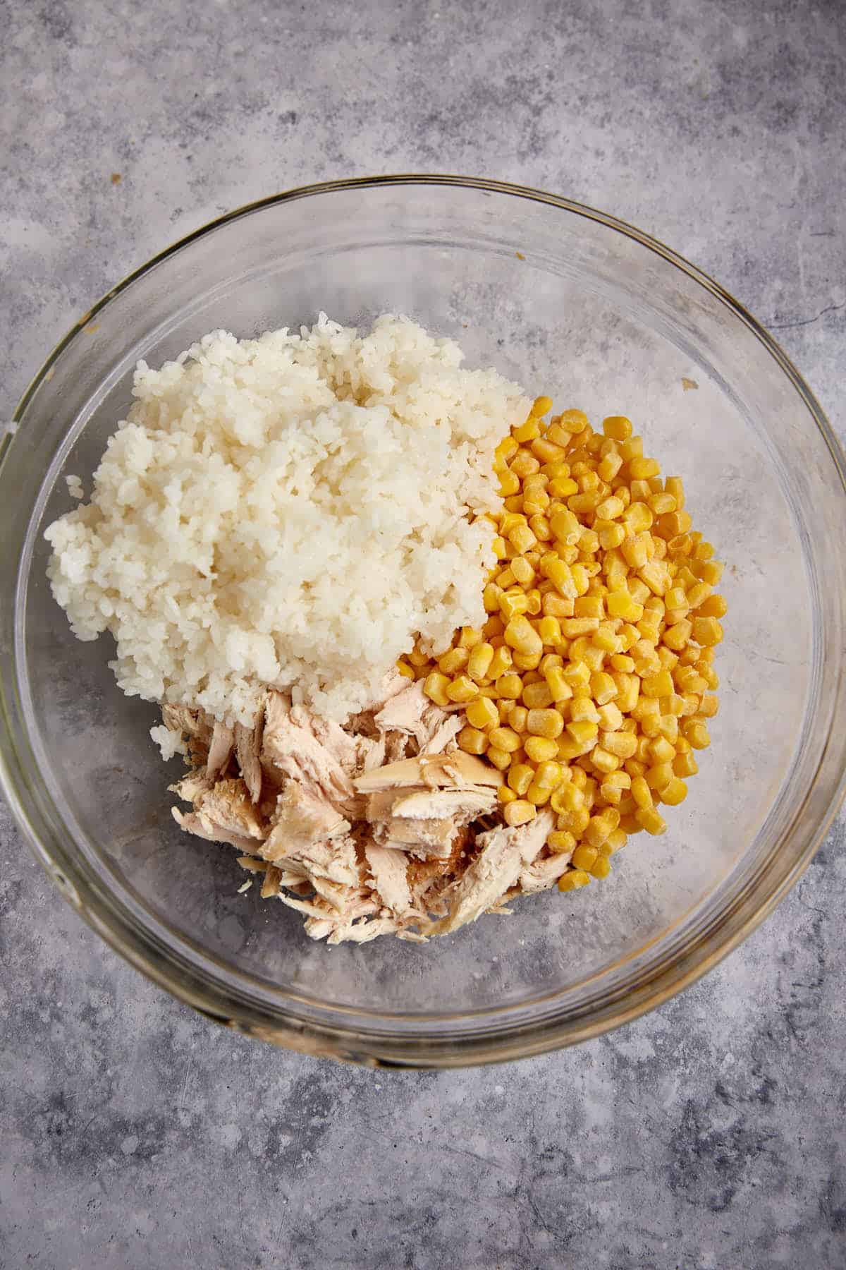 Chicken, rice and corn in a bowl.