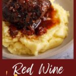 A braised red wine short rib on a pile of mashed potatoes.