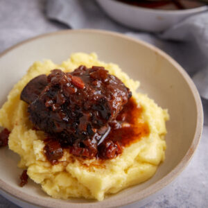 A short rib over mashed potatoes.