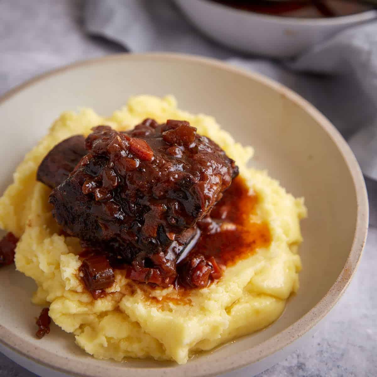 A short rib over mashed potatoes.