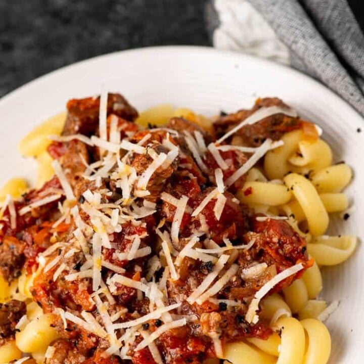 A plate of pork ragu over pasta