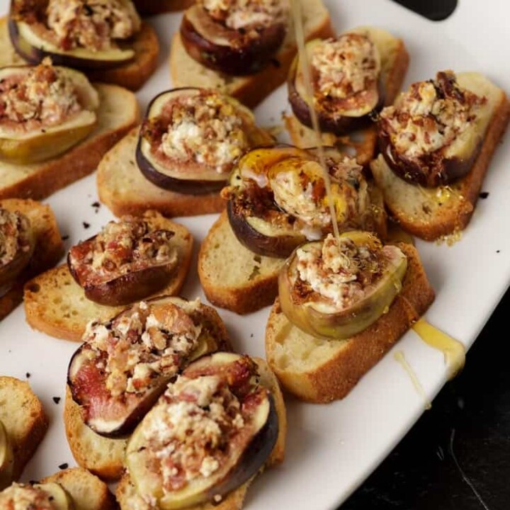 Honey drizzled over fig appetizers