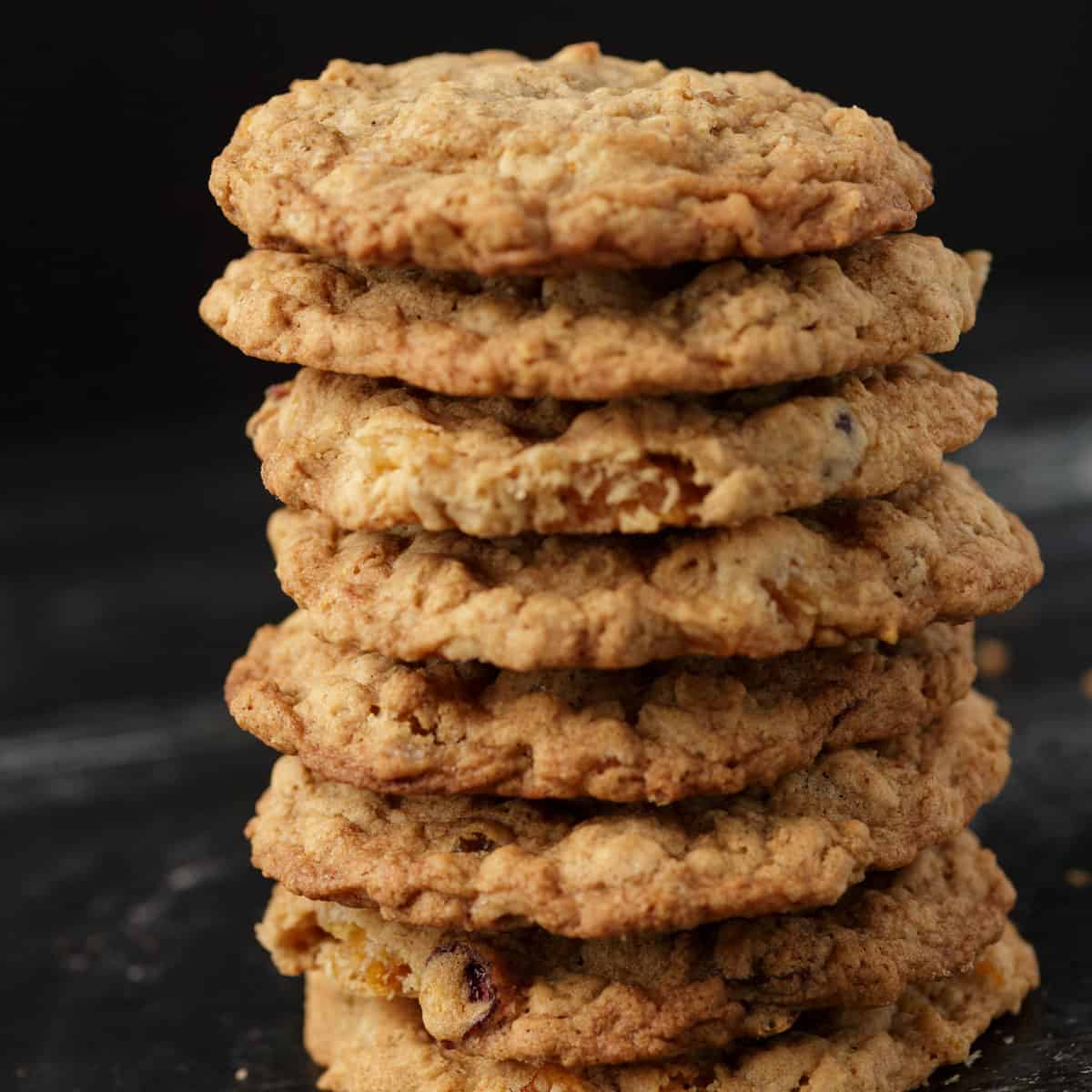 A stack of large cranberry apricot oatmeal cookies