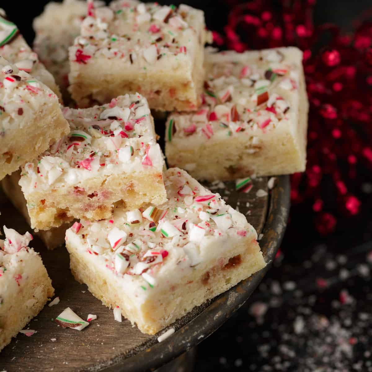 A cake stand of peppermint blondies.