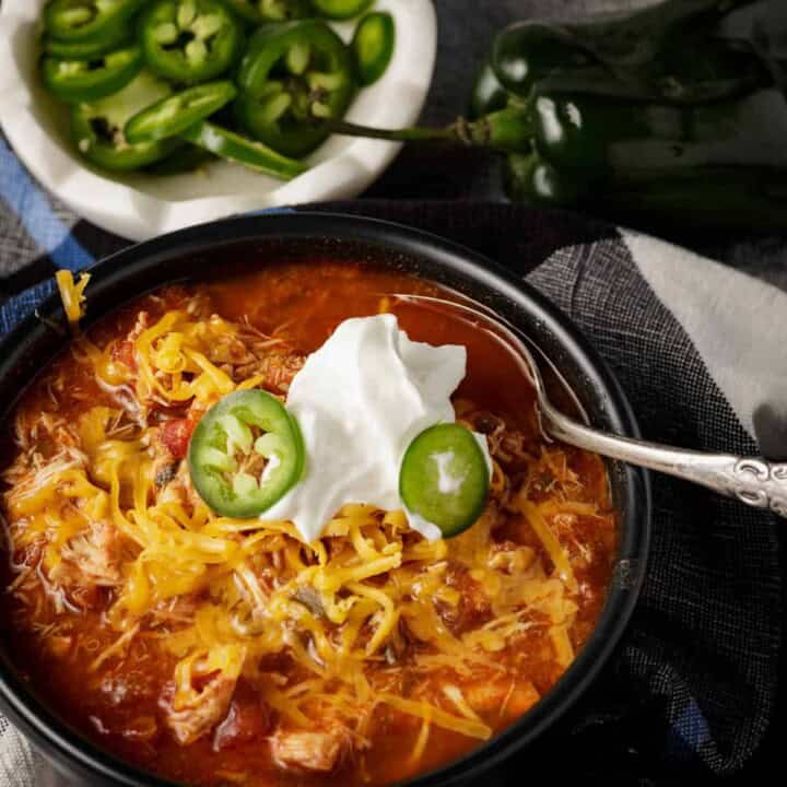 A bowl of easy slow cooker chili with sliced jalapenos