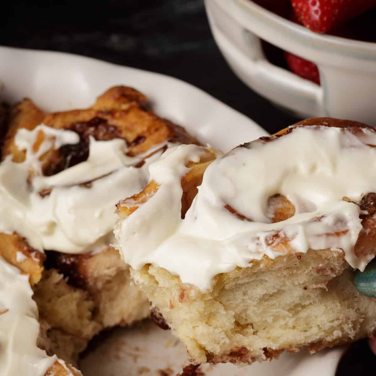 A strawberry cinnamon roll in a pie plate.