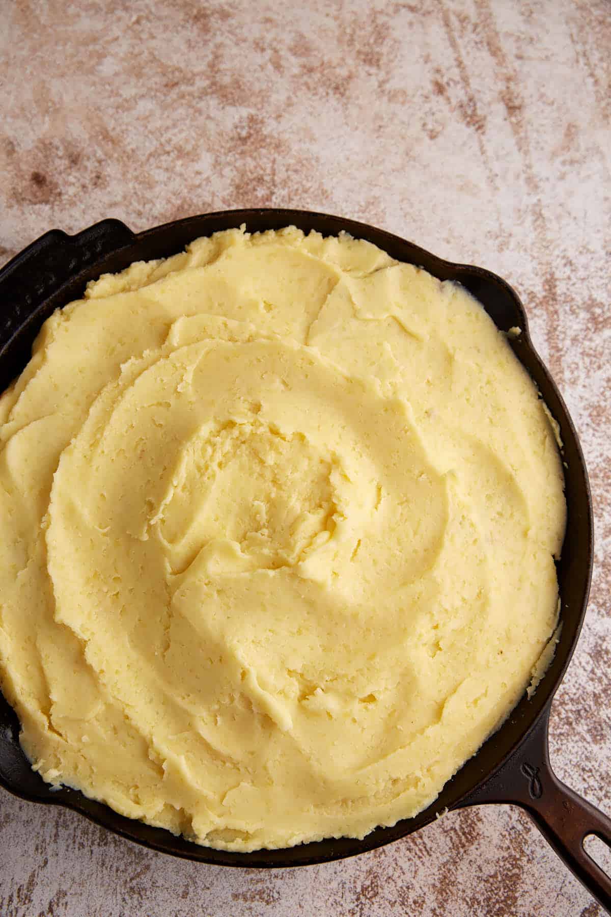 Mashed potatoes on top of meat mixture.