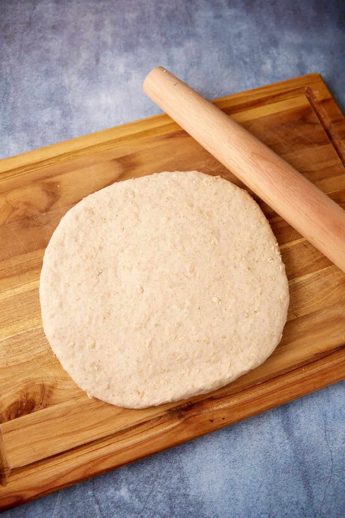 Honey oatmeal bread rolled into a square.