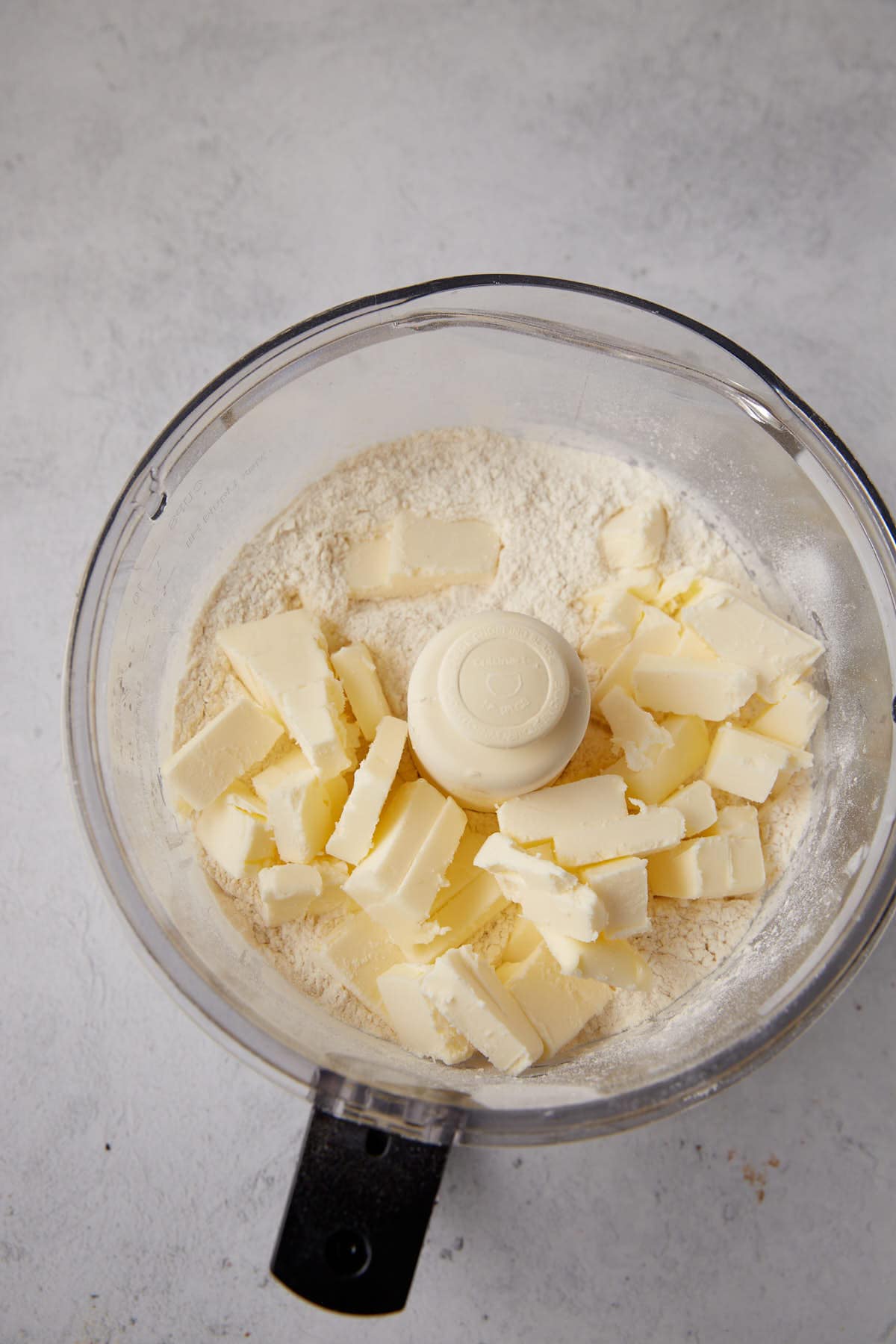 Cold butter in a food processor.