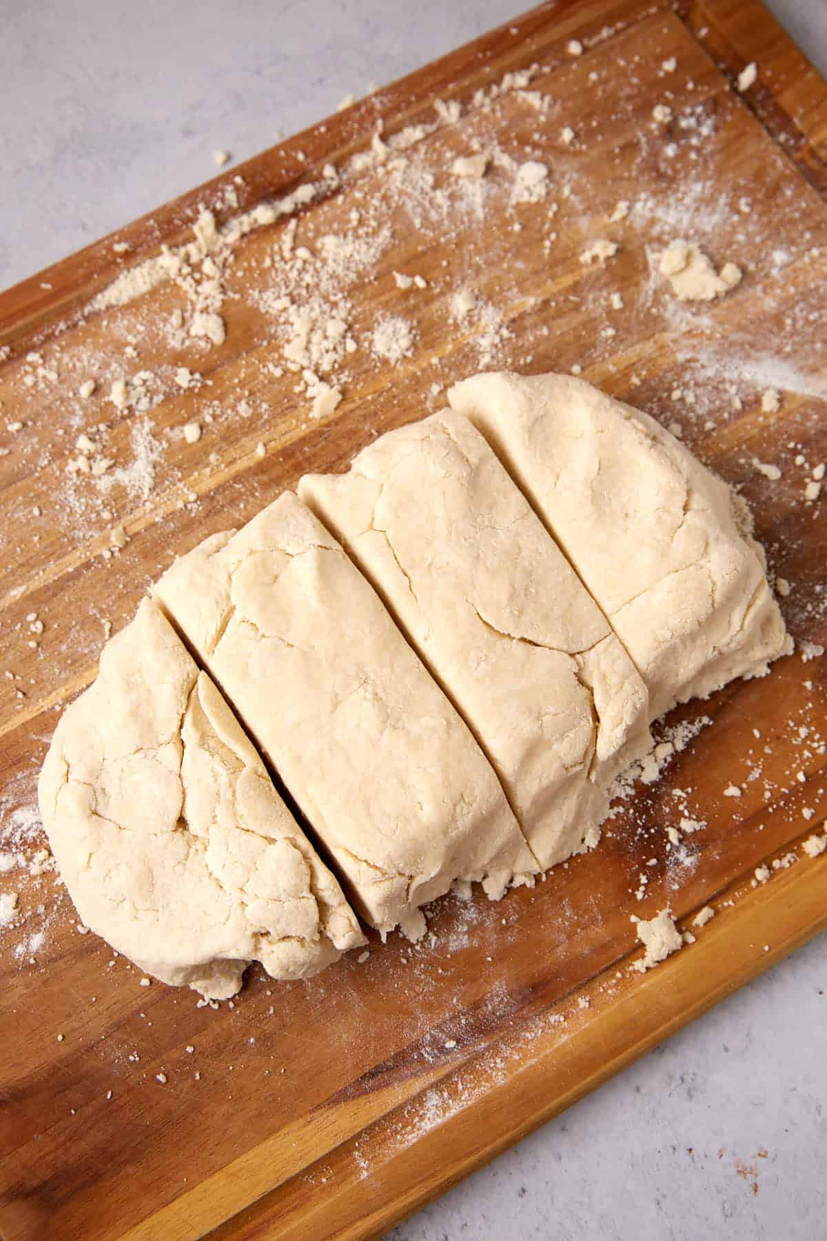 Biscuit dough cut into four rectangles.