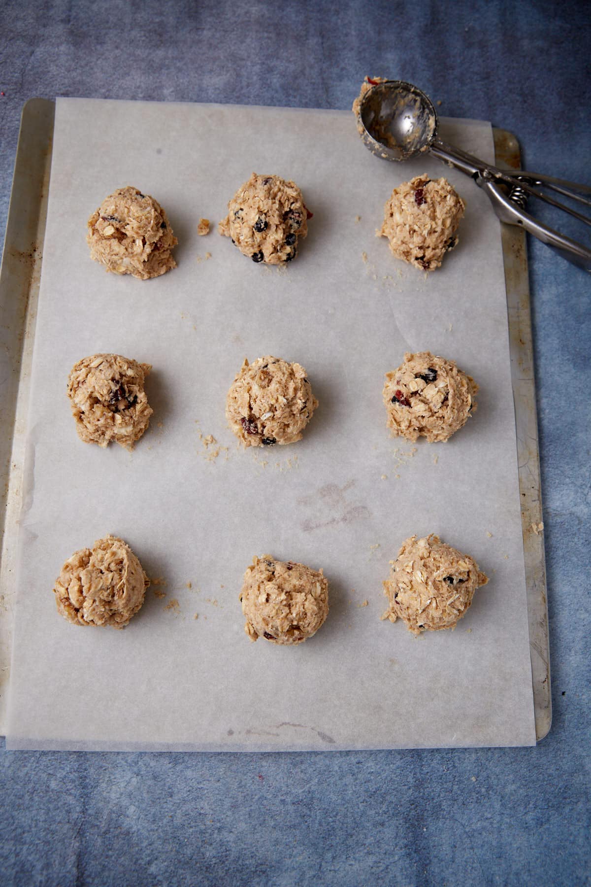 Scone dough in circles on a baking sheet.
