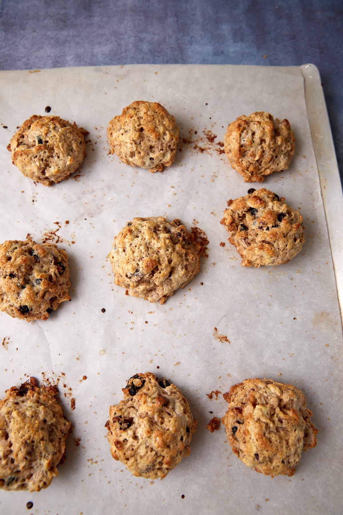 Baked oatmeal scones on a baking sheet.
