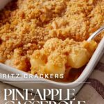 A pineapple cheese casserole with a serving spoon.