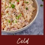 A bowl of cold corn dip with Rotel next to chips.