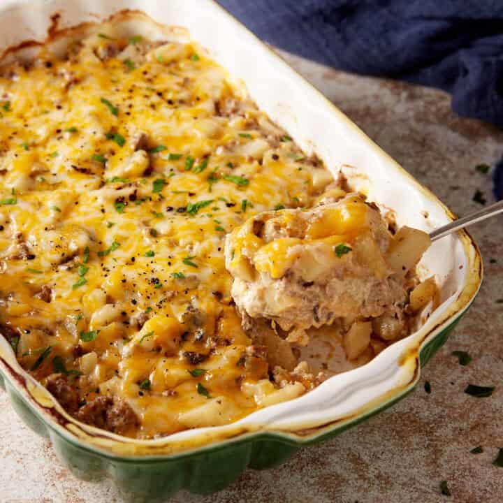 A serving spoon of ground beef potato casserole.