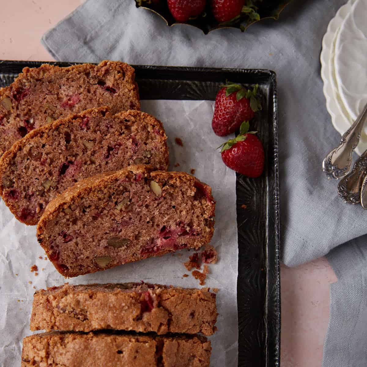 Slices of strawberry bread on a platter.