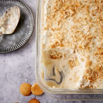 A cream cheese banana pudding with a serving removed.