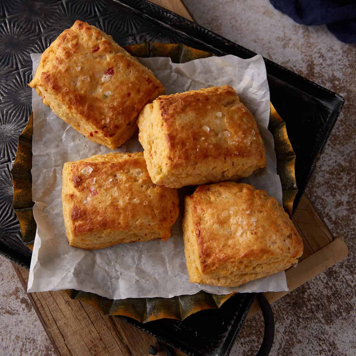 Four square biscuits on a platter.