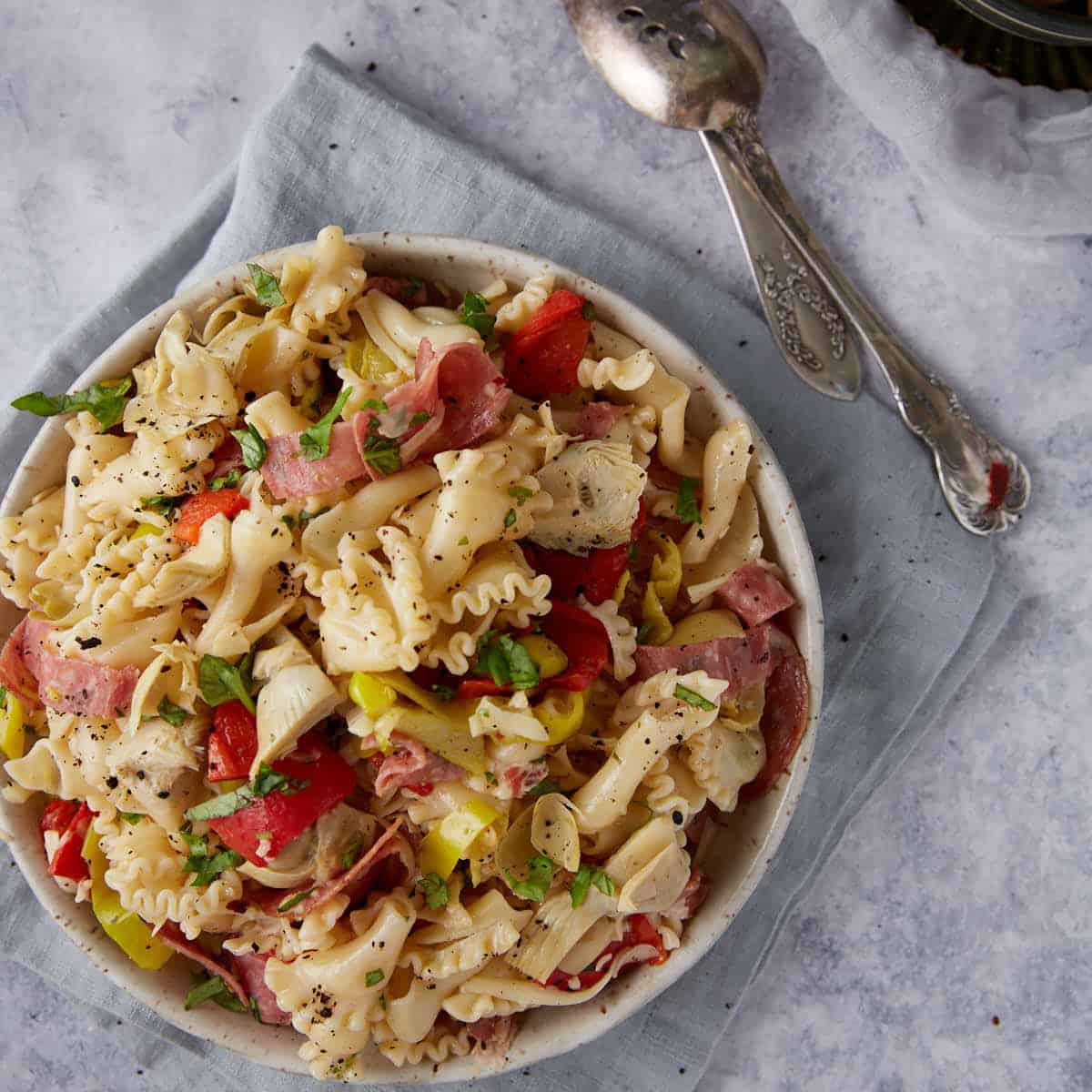 A serving bowl of pasta salad.