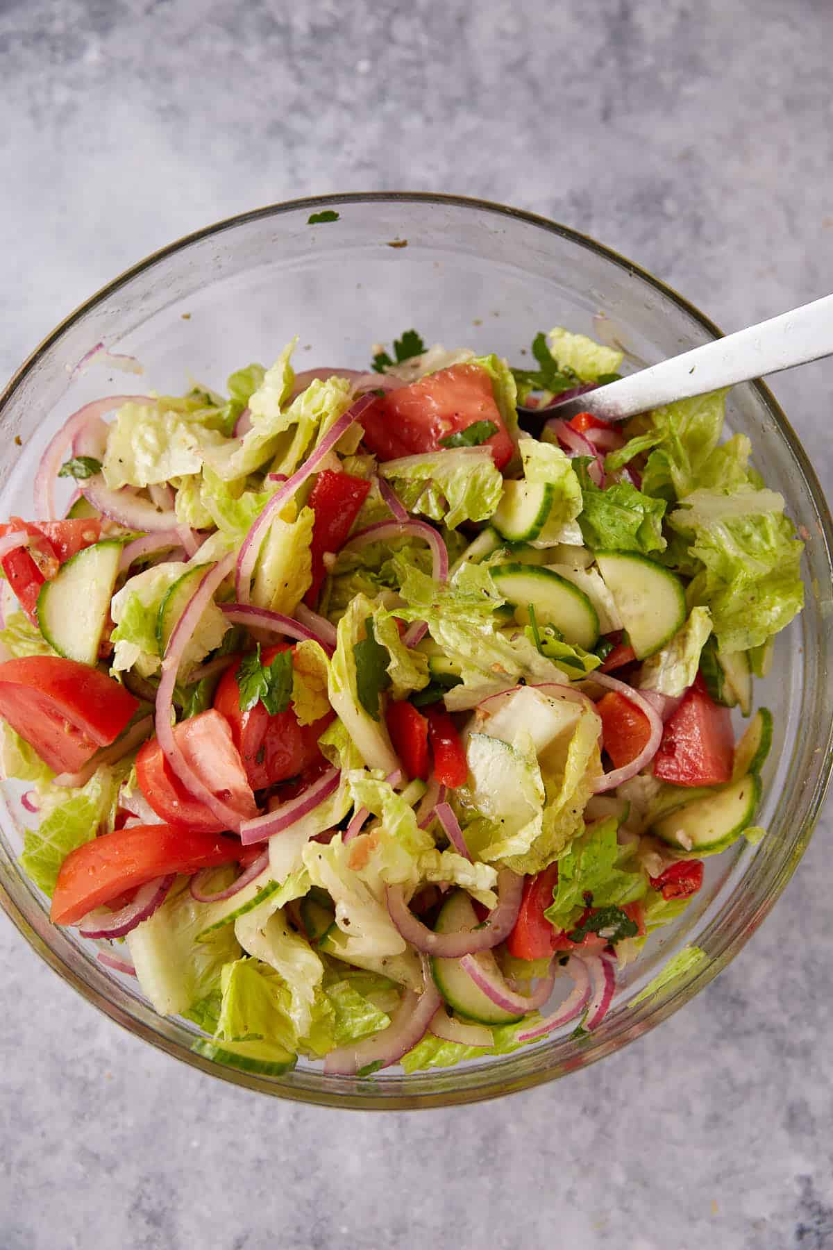 Lettuce added to a Greek salad.