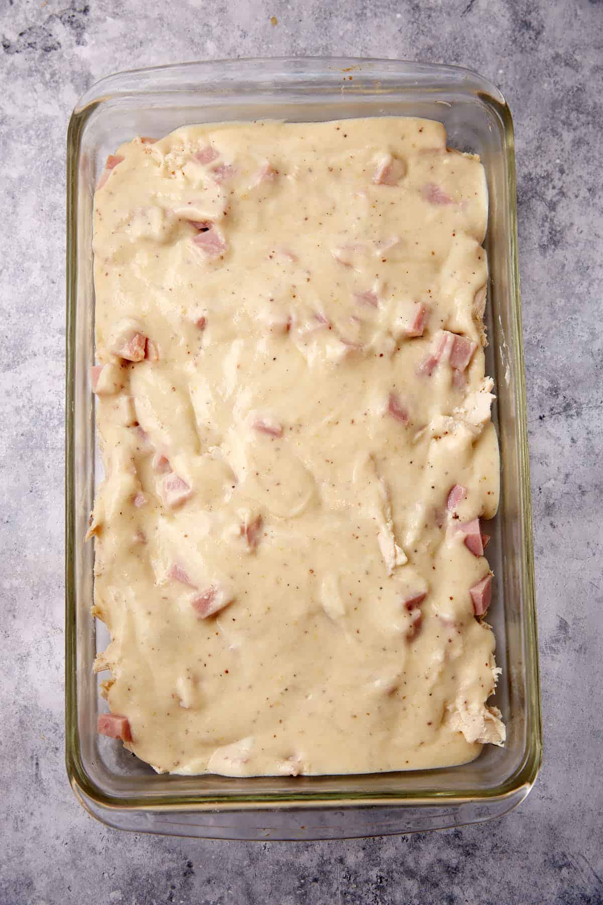 Sauce poured over chicken and ham.