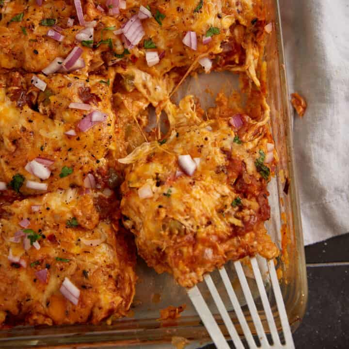 A baking dish of chicken enchilada casserole.