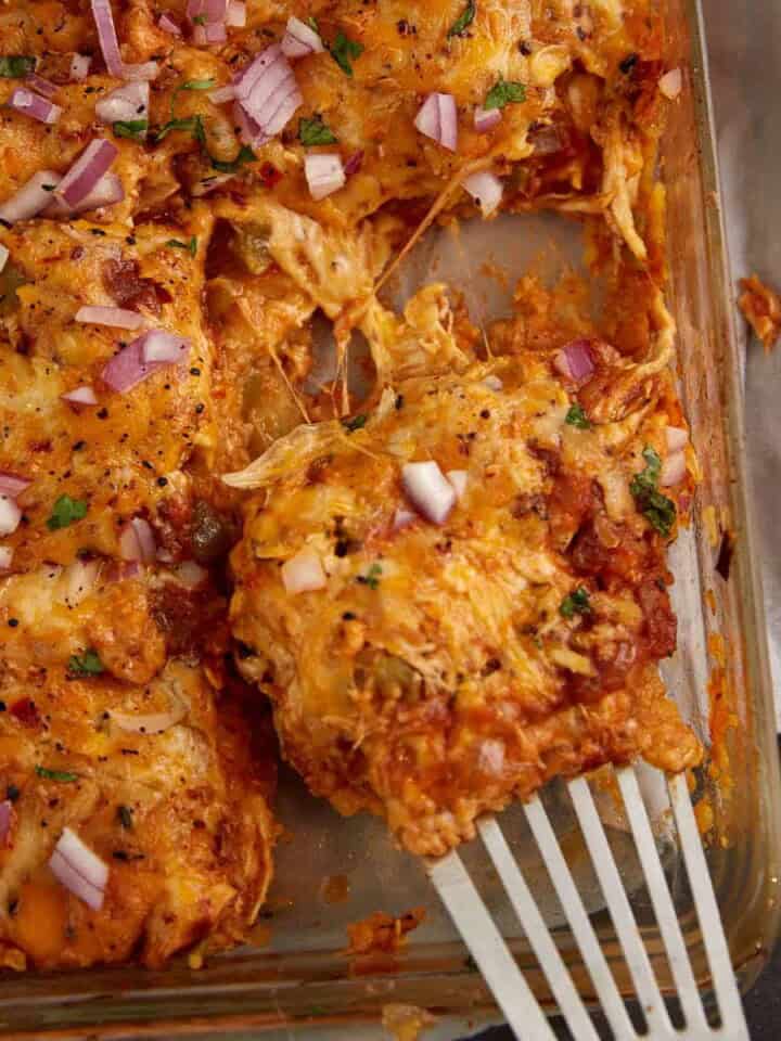 A baking dish of chicken enchilada casserole.