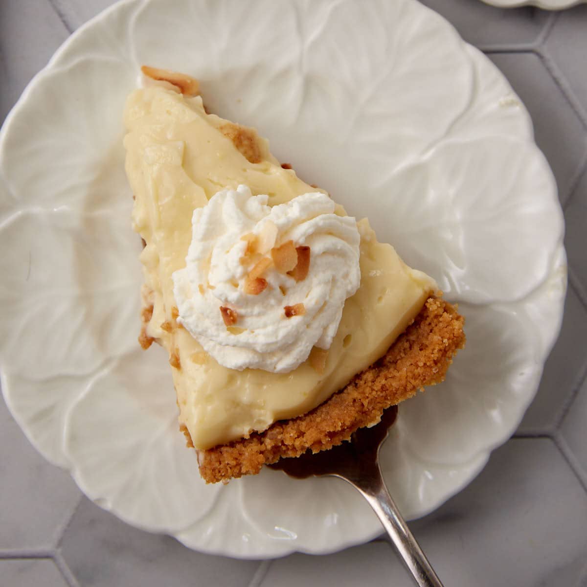 A single slice of coconut cream pie.