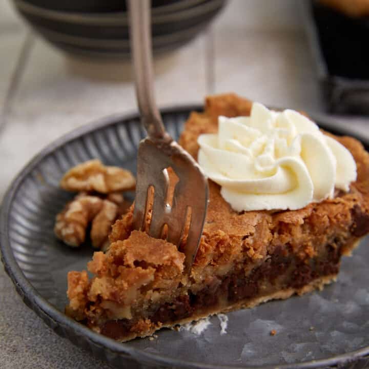 A piece of Derby Pie with a fork in it.