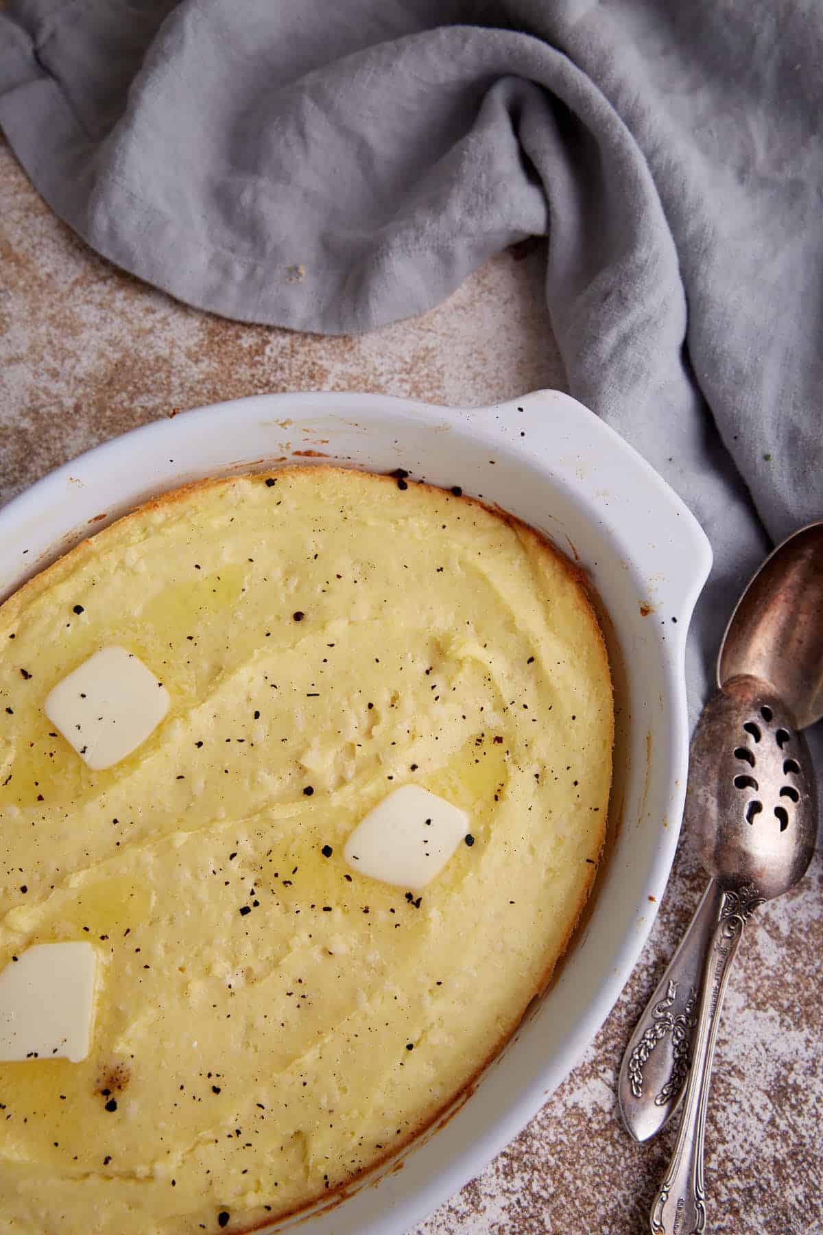 Butter melting on a baked spoon bread.