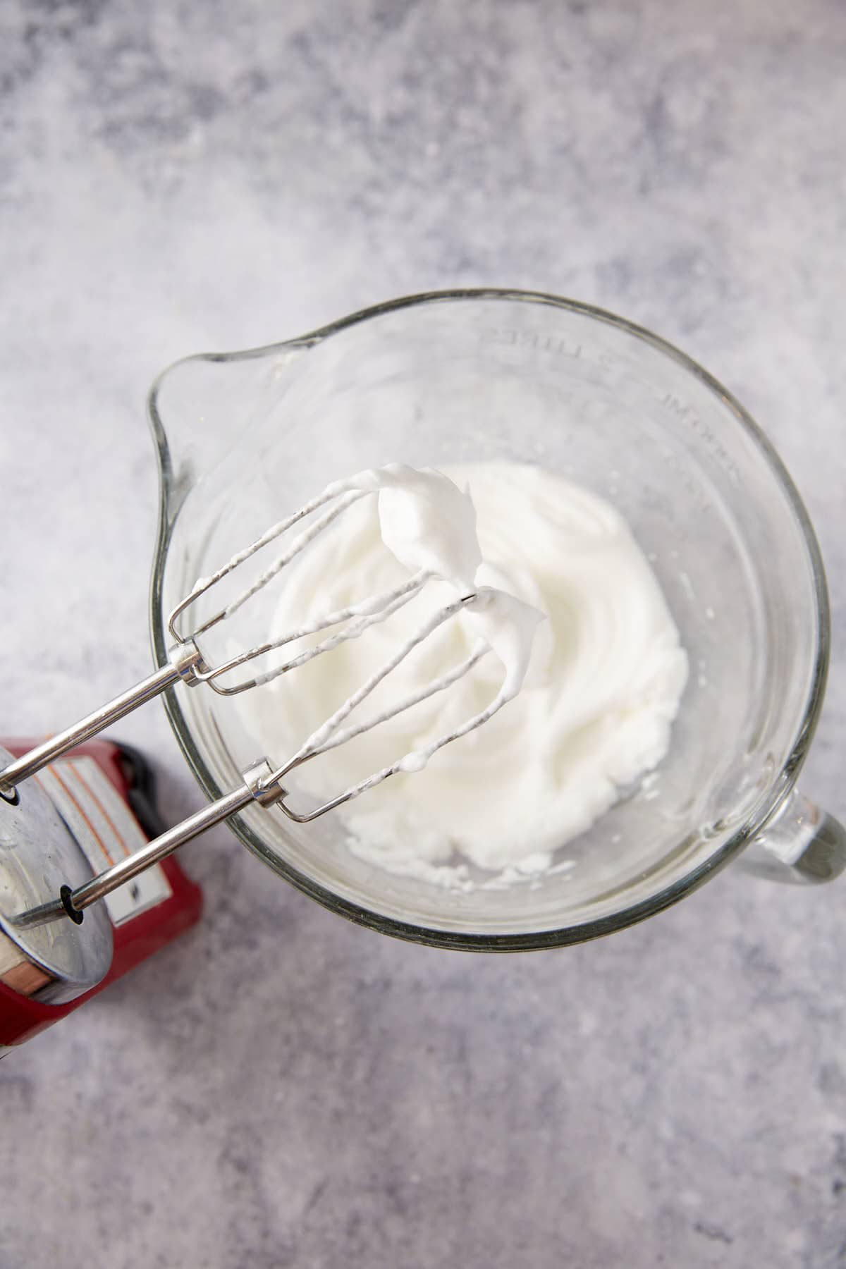 Egg whites beaten in a bowl.