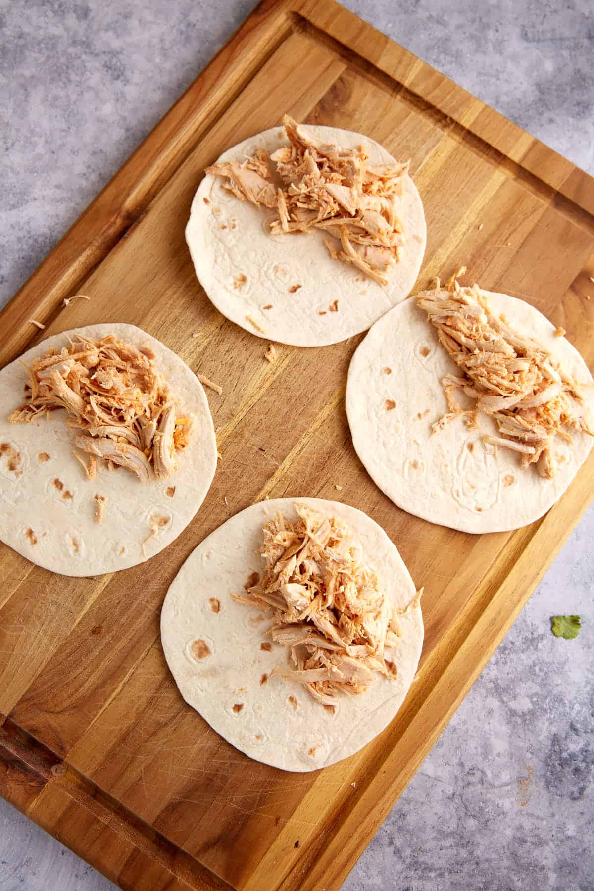 Tortillas topped with chicken.