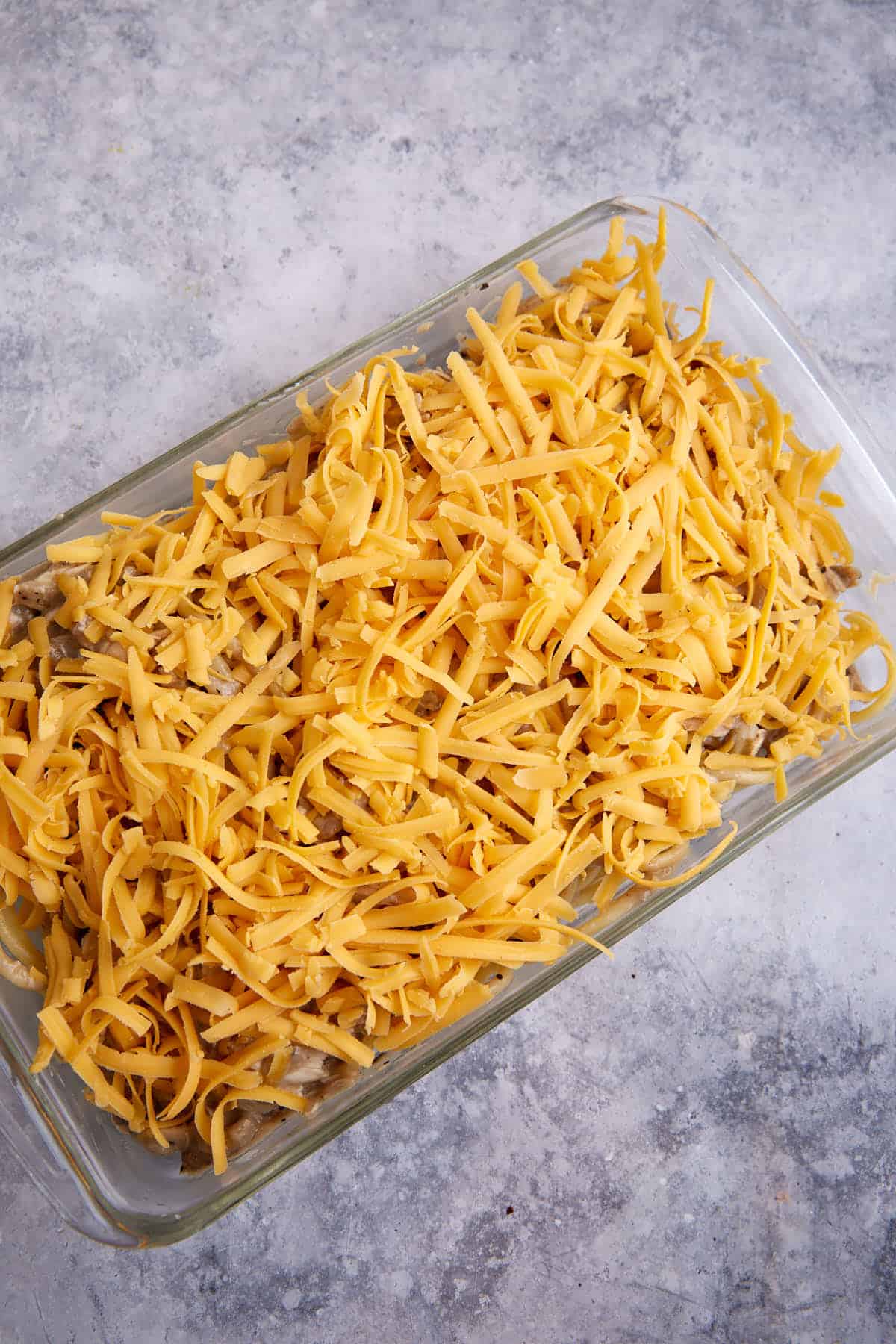 Cheese added to the top of the baked casserole.