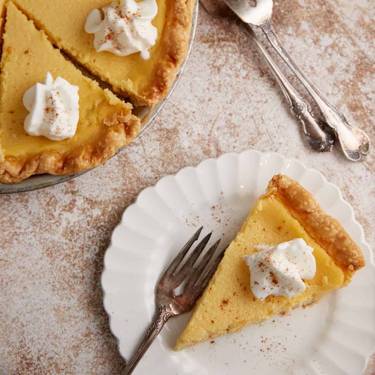 A slice of eggnog pie with a fork.