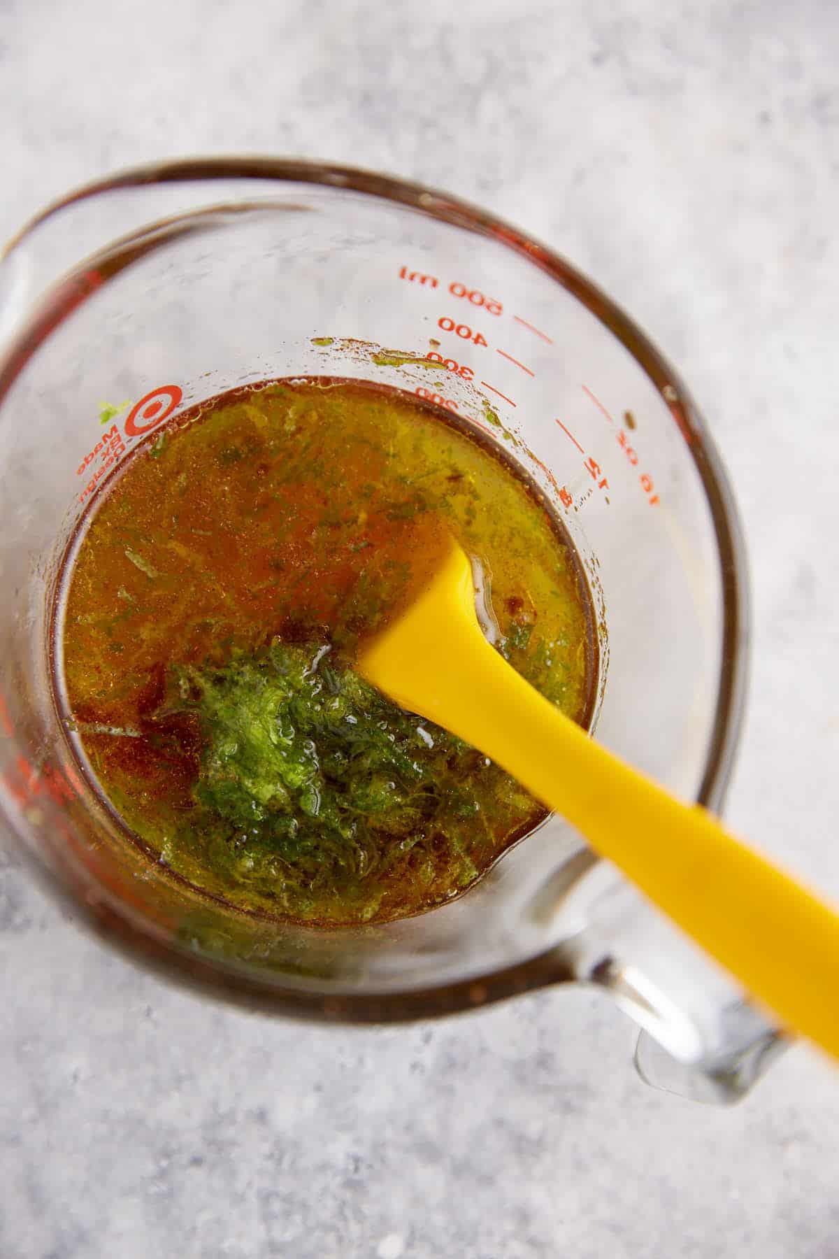 The liquid ingredients in a measuring cup.