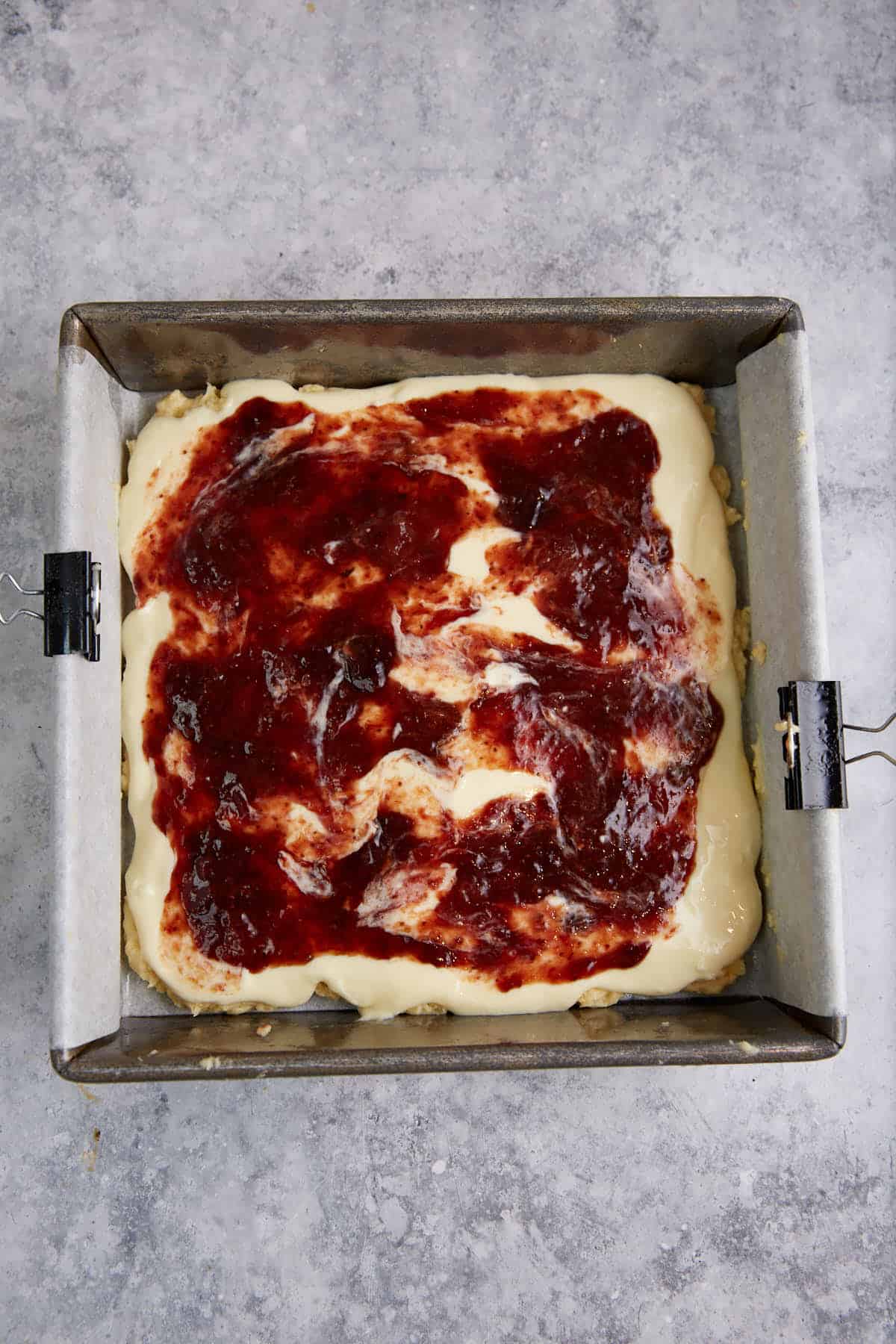 Strawberry jam on top fo the cream cheese layer.