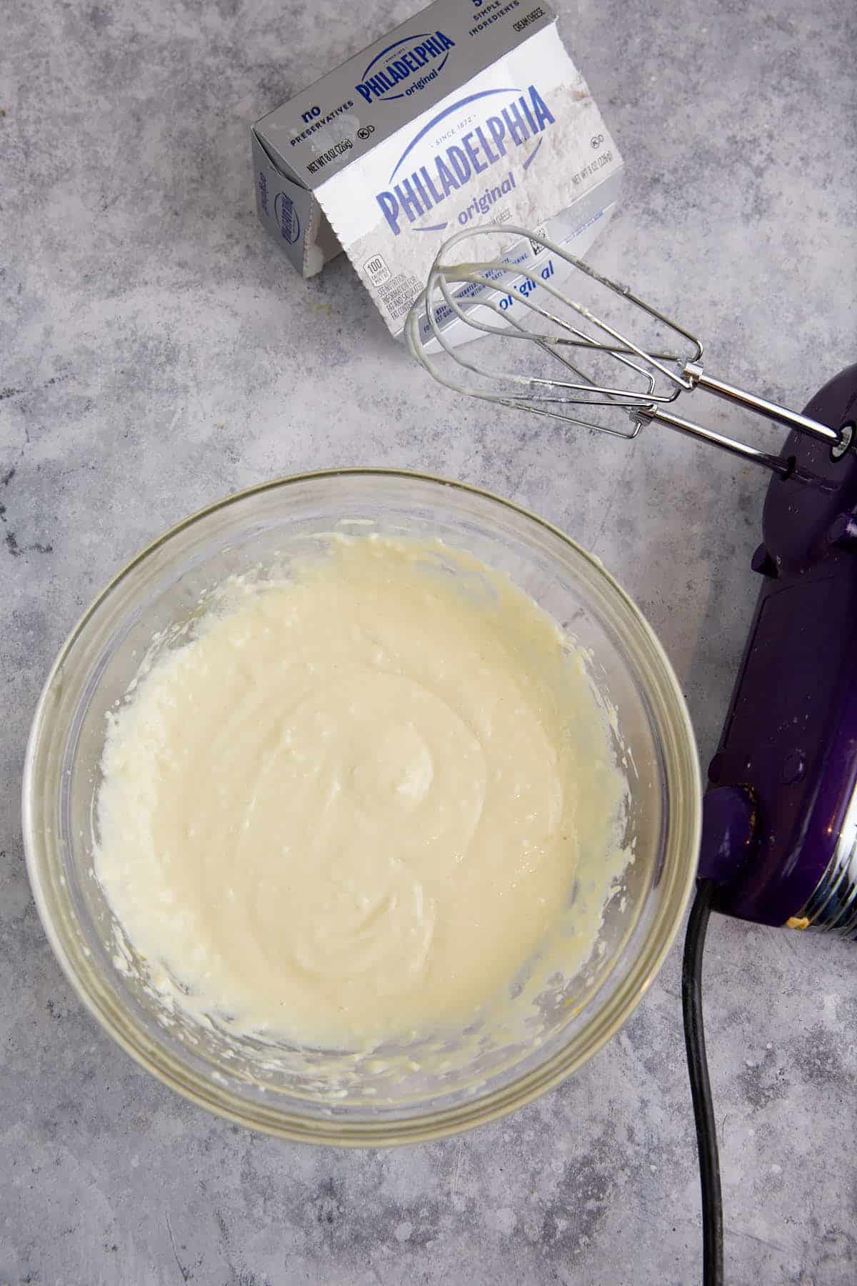 A bowl of cream cheese filling.