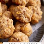 A platter stacked with cream cheese sausage balls.