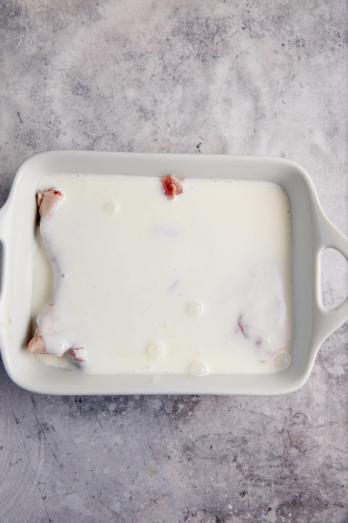 Pork chops covered with buttermilk.