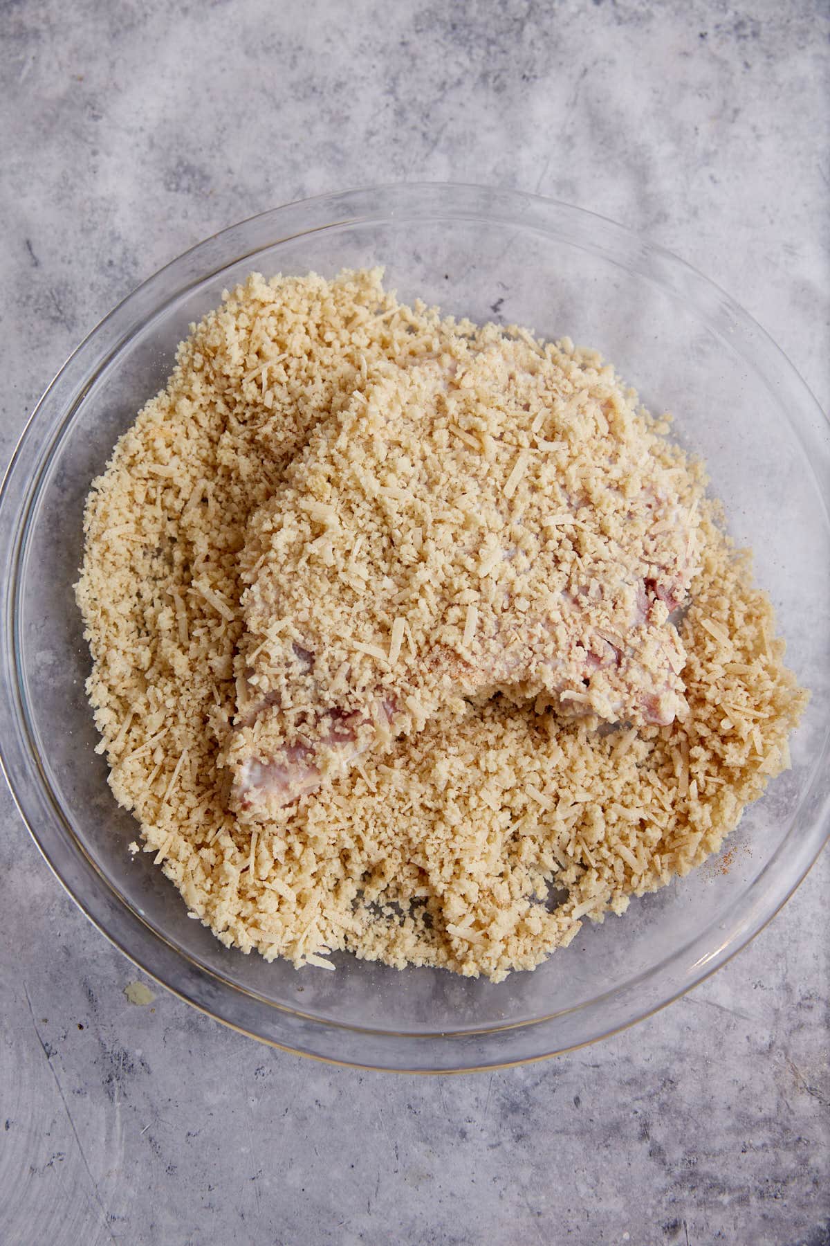 A pork chop coated in panko crumbs.