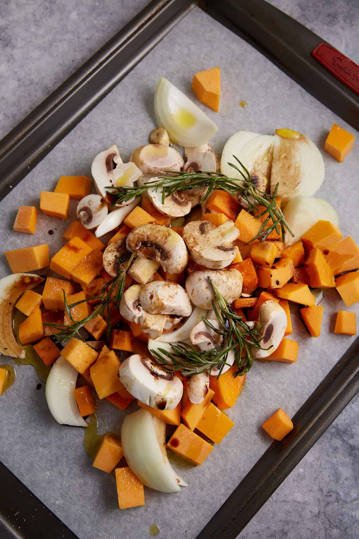 Chopped vegetables on a baking sheet.
