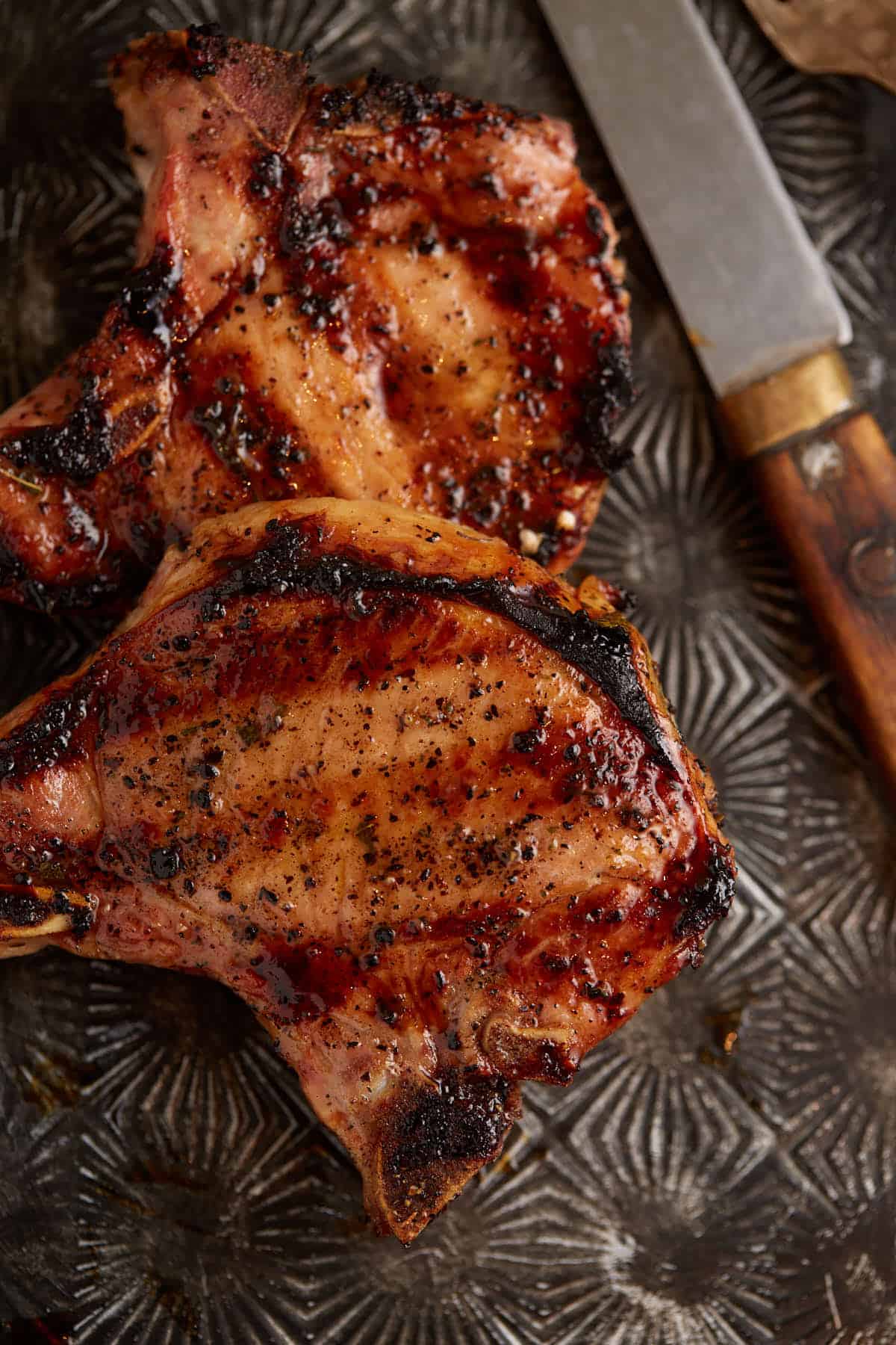 two grilled pork chops.