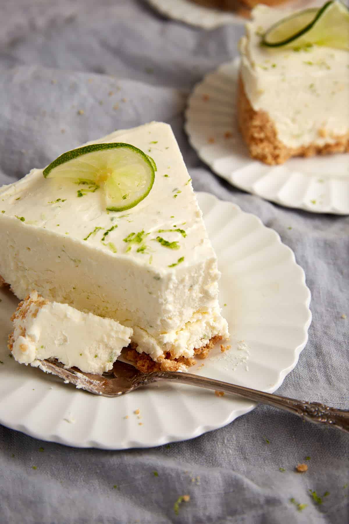 A bite on a fork of key lime pie.