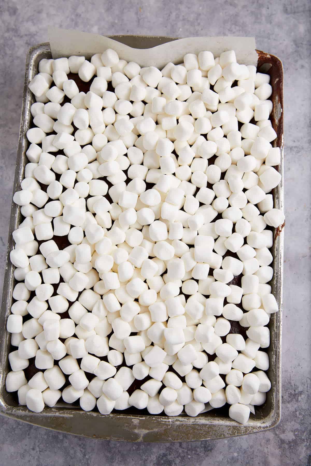 Mini marshmallows on top of a hot cake.