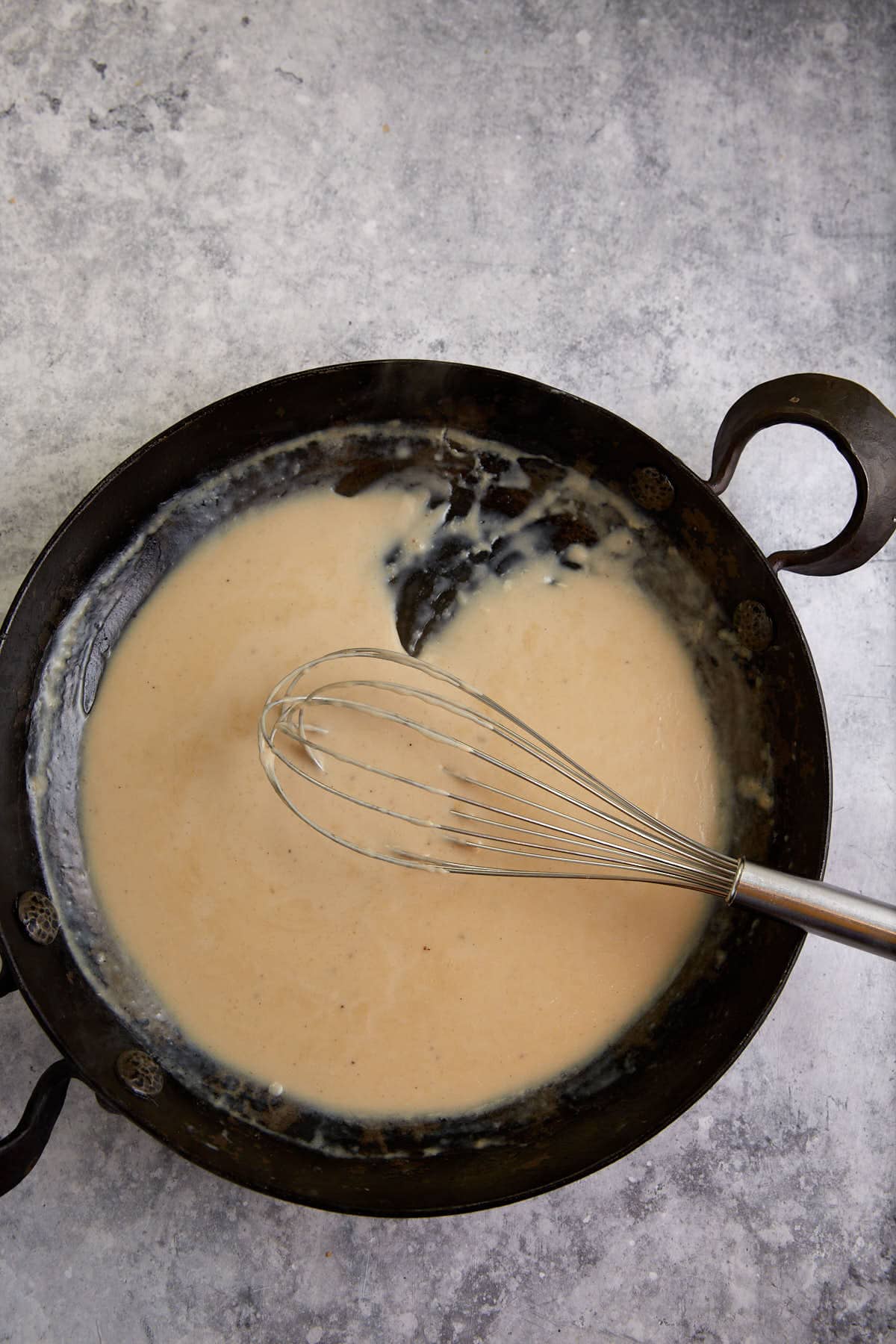 A thickened roux in a skilelt.