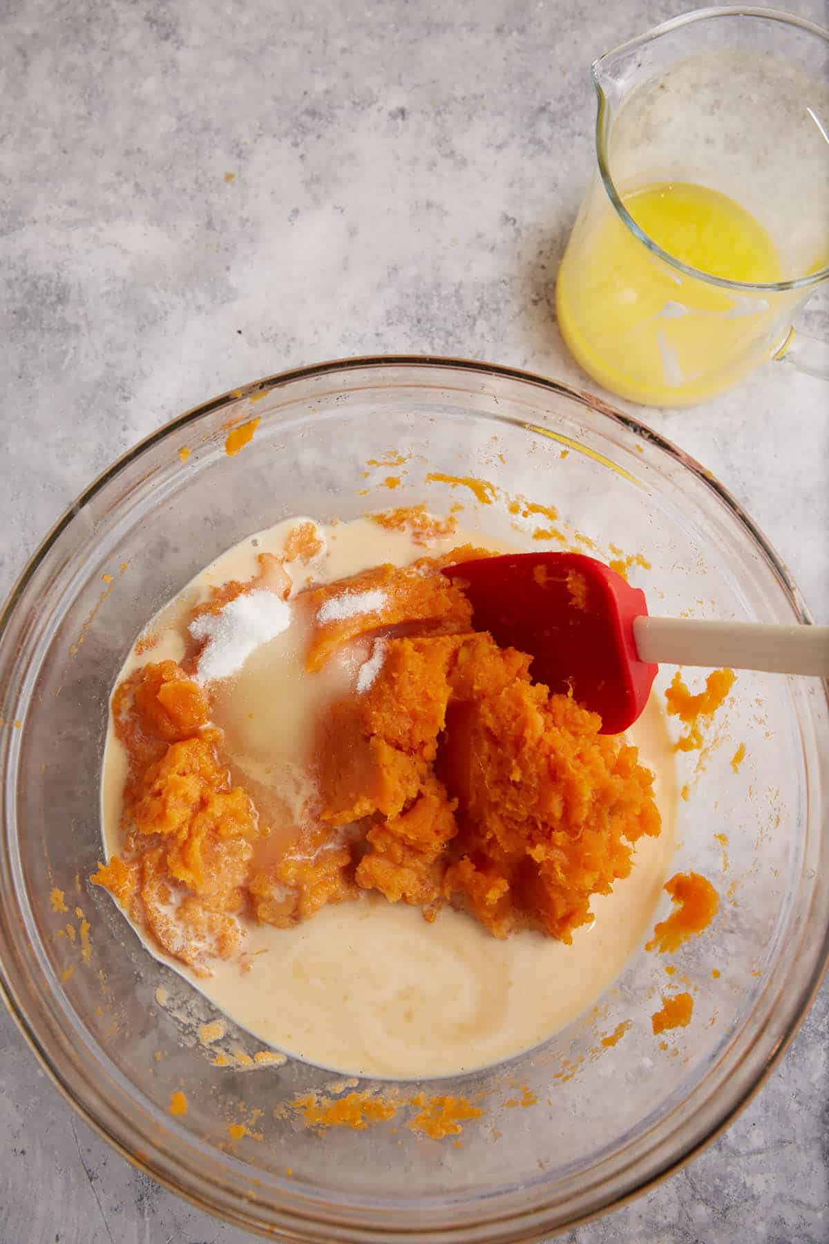 Sugar and milk added to mashed sweet potatoes.
