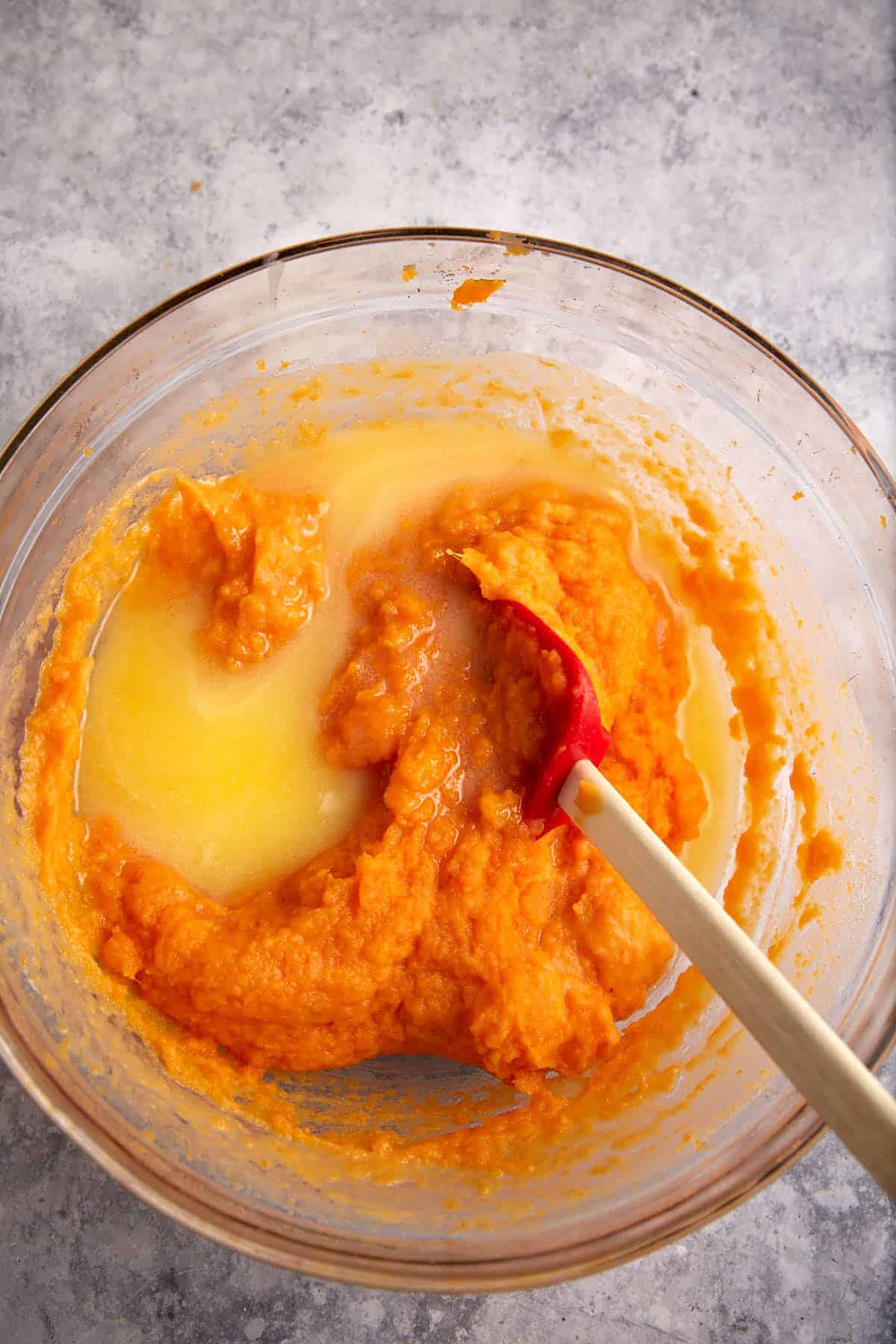 Melted butter added to mashed sweet potatoes.